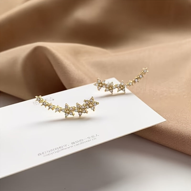 Lyxiga örhängen med blommig strass