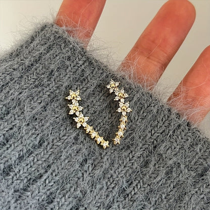 Lyxiga örhängen med blommig strass