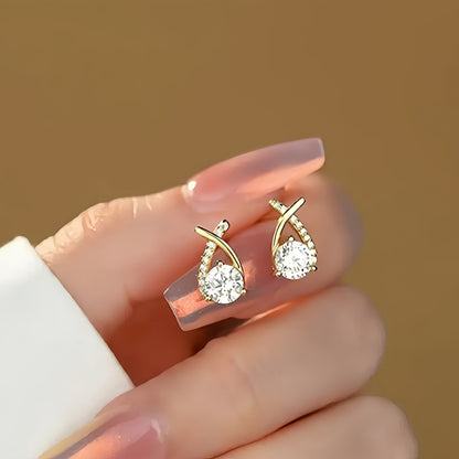 Örhängen med zirkoniakors och gyllene kors