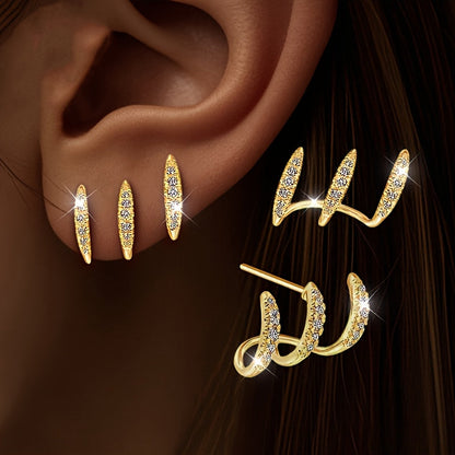 Eleganta örhängen med strass och tre klor