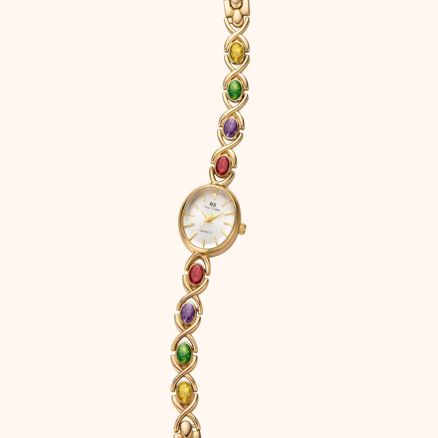 Armbandsklocka med ädelstenar och guld