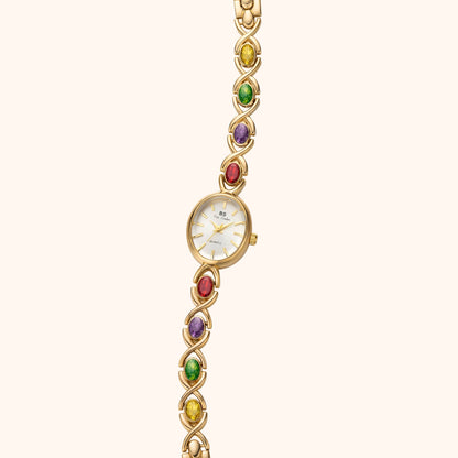 Armbandsklocka med ädelstenar och guld