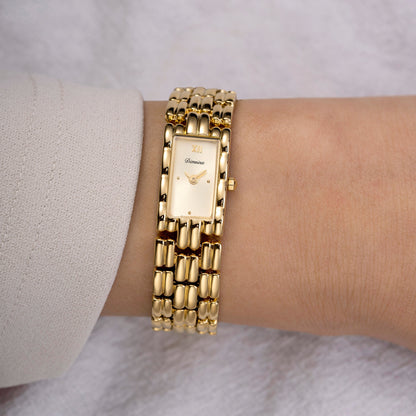 Rektangulärt armbandsur med guldfärgad rem