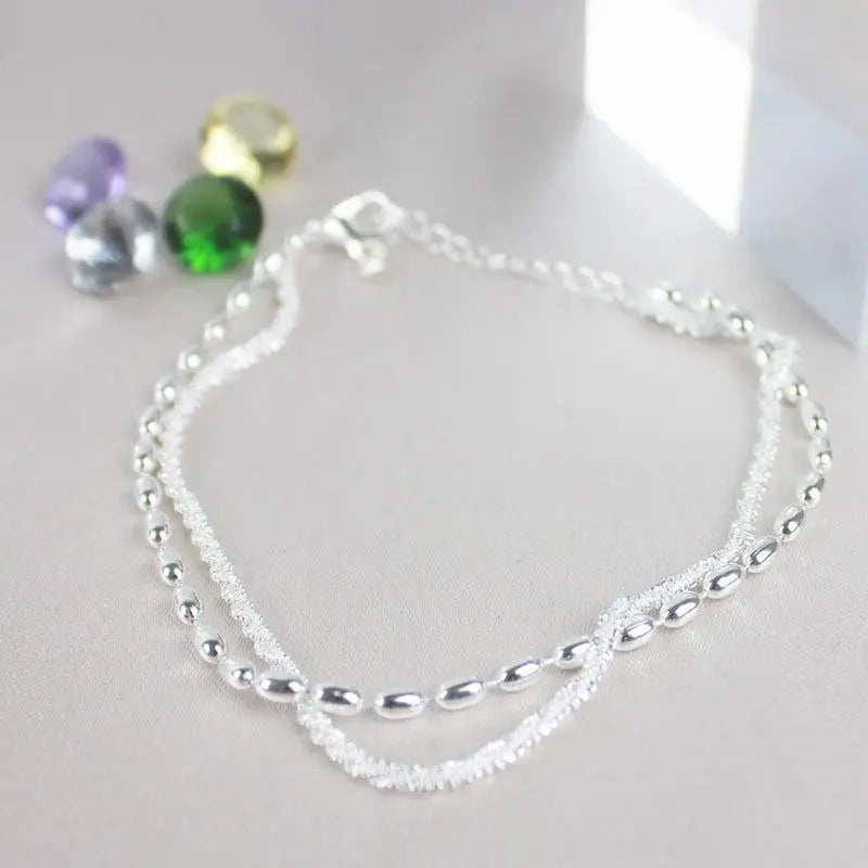 Elegant silverarmband med zirkoniastenar 