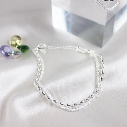 Elegant silverarmband med zirkoniastenar 