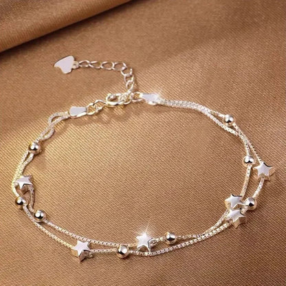 Armband med stjärntofs och kristall 