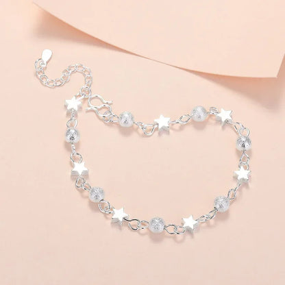 Armband med stjärntofs och kristall 