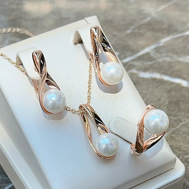 Roséguldsring med geometrisk pärldetalj