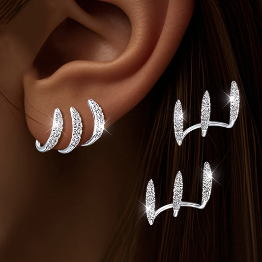 Eleganta örhängen med strass och tre klor