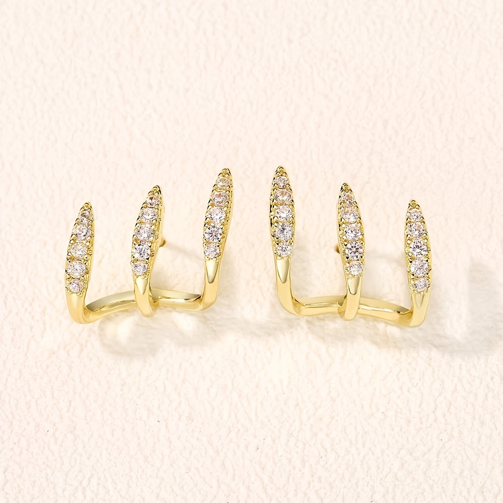 Eleganta örhängen med strass och tre klor