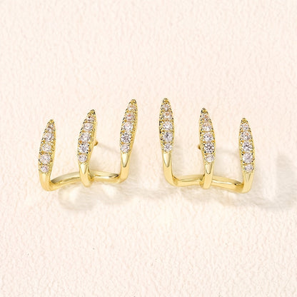 Eleganta örhängen med strass och tre klor