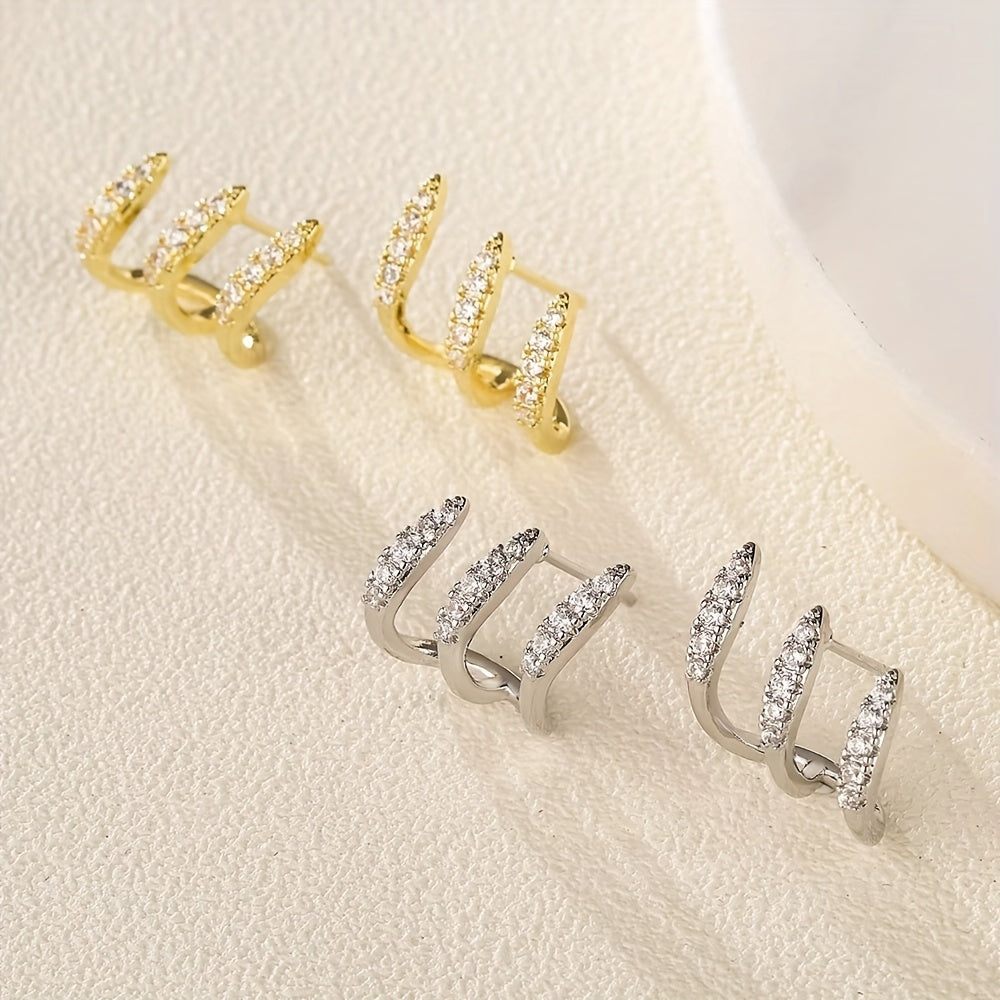 Eleganta örhängen med strass och tre klor