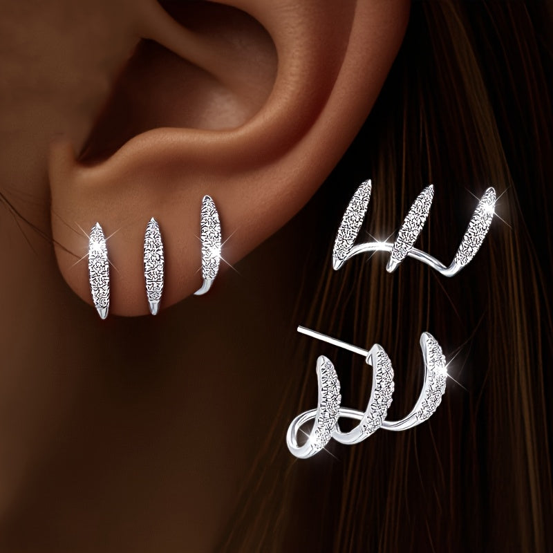 Eleganta örhängen med strass och tre klor