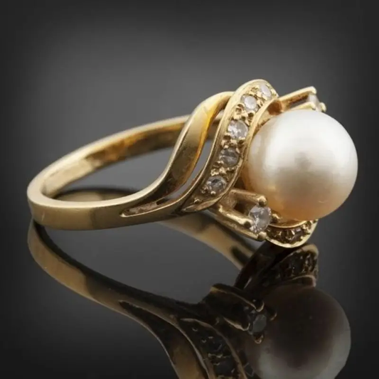 Elegant pärla och strålande guldring